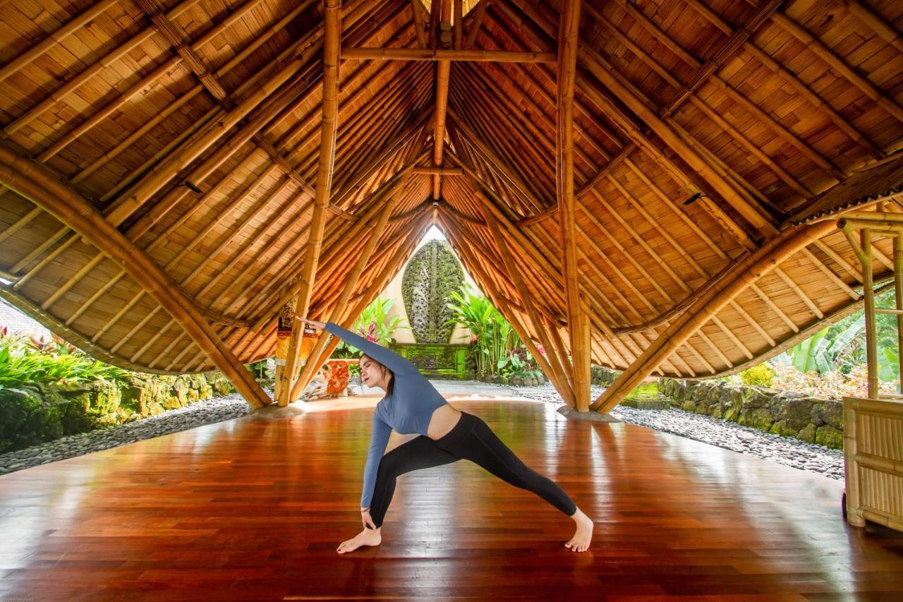 Weda Cita Resort And Spa By Mahaputra Убуд Екстер'єр фото A woman practicing yoga at the Four Seasons Resort Maui